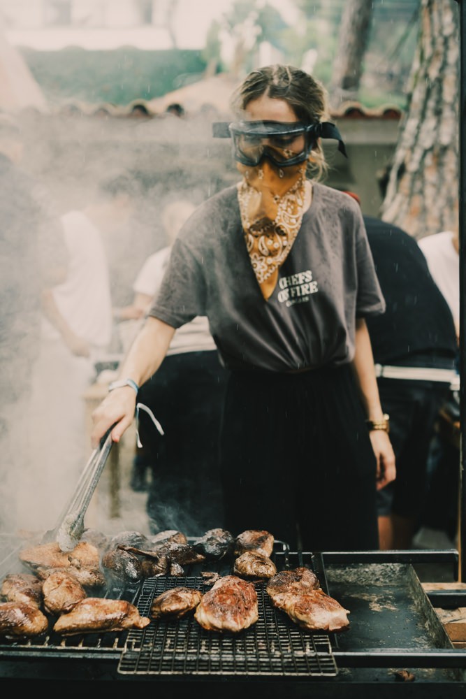 Woman grilling meat at Chefs on Fire Portugal