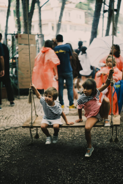 Two children on swing at Chefs on Fire Portugal