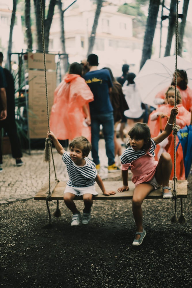 Two children on swing at Chefs on Fire Portugal