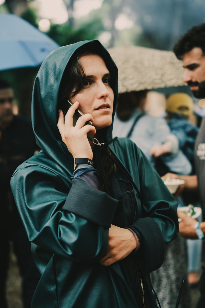Sofia Santos taking a call behind the scenes at Chefs on Fire Cascais