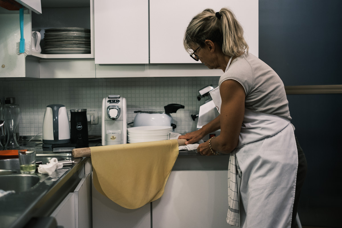Air drying circular pasta sheet during Bologna cooking class