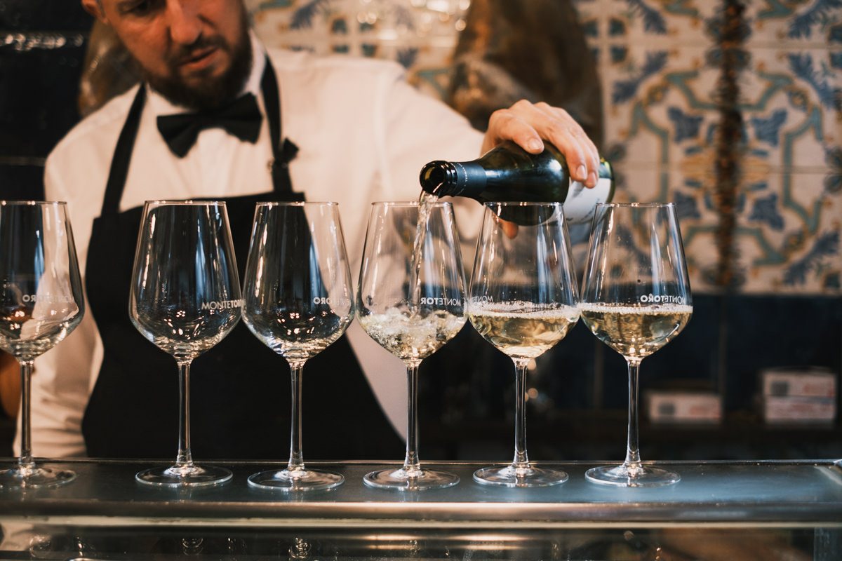 White wine being poured at El Lacon