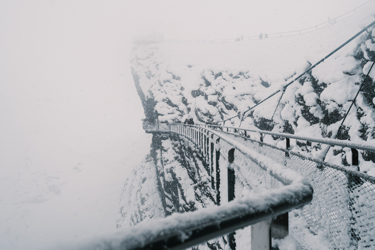 Grindelwald First Cliff Walk bridge covered in snow