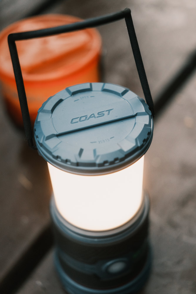 Coast EAL35R lantern on camping table